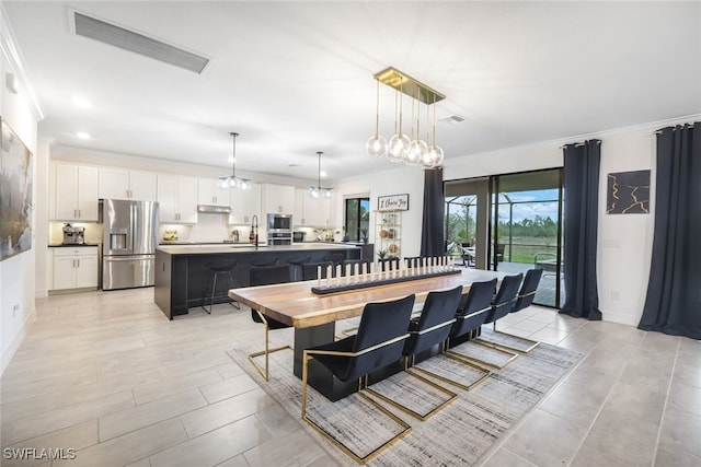 19477 The Place Blvd, Estero, FL 33928 - dining area featuring crown molding, baseboards, and recessed lighting