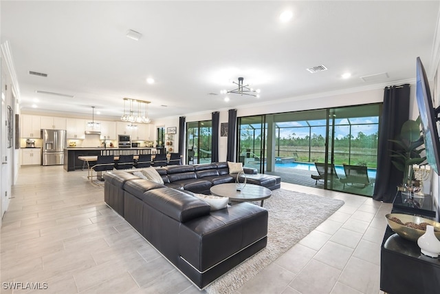 19477 The Place Blvd, Estero, FL 33928 - living area with ornamental molding, light tile patterned floors, and recessed lighting