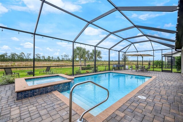 19477 The Place Blvd, Estero, FL 33928 - view of pool featuring a patio area, a lanai, and a pool with connected hot tub
