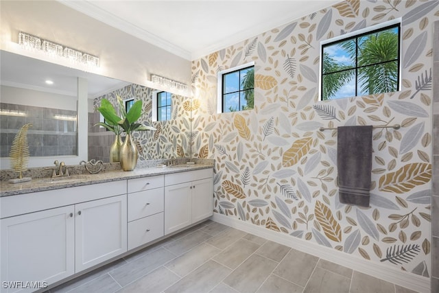 19477 The Place Blvd, Estero, FL 33928 - bathroom with wallpapered walls, ornamental molding, double vanity, baseboards, and a tile shower