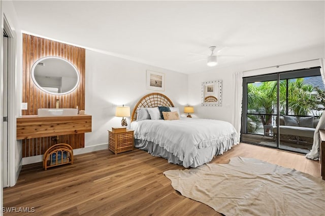 4805 Gary Rd, Bonita Springs, FL 34134 - bedroom with access to exterior, wood finished floors, and a ceiling fan