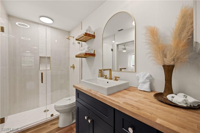 4805 Gary Rd, Bonita Springs, FL 34134 - full bath with vanity, a stall shower, wood finished floors, and ceiling fan