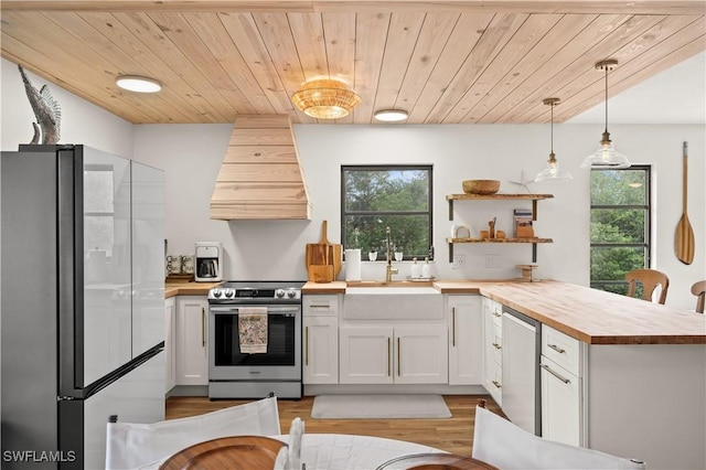 4805 Gary Rd, Bonita Springs, FL 34134 - kitchen with stainless steel appliances, wooden counters, custom exhaust hood, a peninsula, and wooden ceiling
