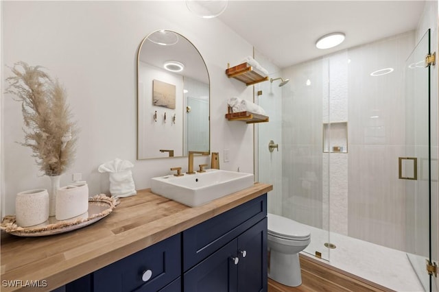 4805 Gary Rd, Bonita Springs, FL 34134 - full bathroom with a stall shower, vanity, and wood finished floors