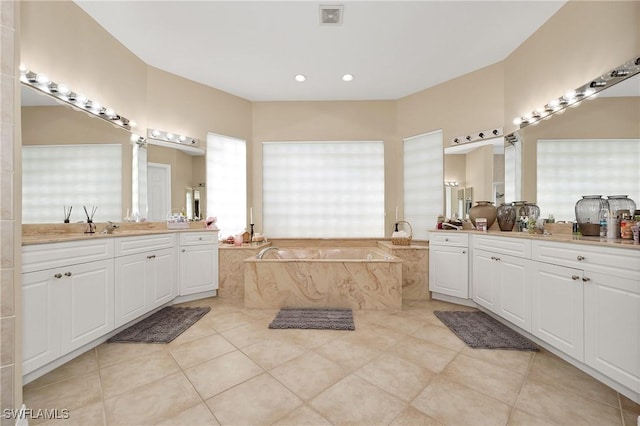1640 Golden Gate Blvd W, Naples, FL 34117 - bathroom with tile patterned floors, a garden tub, two vanities, and recessed lighting
