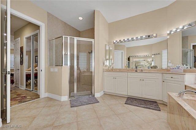 1640 Golden Gate Blvd W, Naples, FL 34117 - full bathroom with a shower stall, tile patterned floors, vanity, and a garden tub