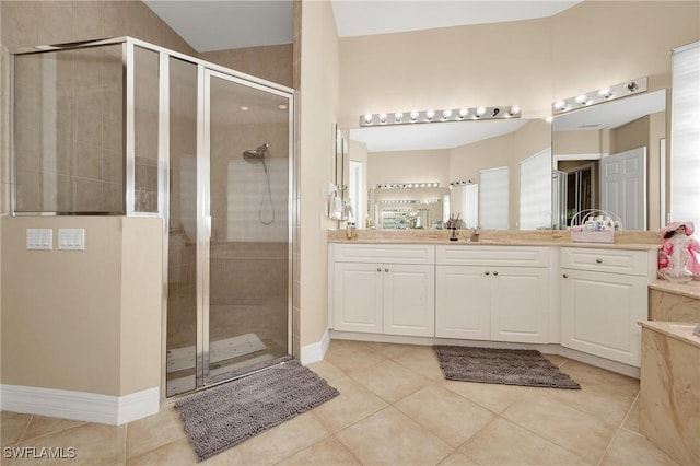 1640 Golden Gate Blvd W, Naples, FL 34117 - bathroom featuring a shower stall, tile patterned flooring, and vanity