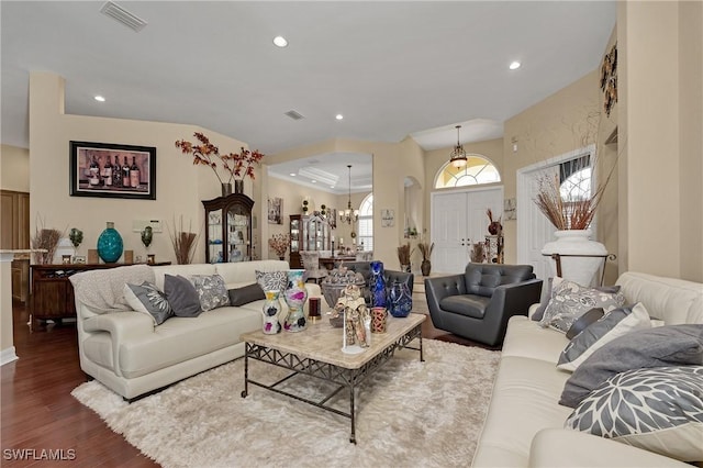1640 Golden Gate Blvd W, Naples, FL 34117 - living area featuring wood finished floors, arched walkways, recessed lighting, and a chandelier