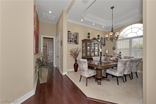 1640 Golden Gate Blvd W, Naples, FL 34117 - dining area with a chandelier, ornamental molding, recessed lighting, a tray ceiling, and wood finished floors