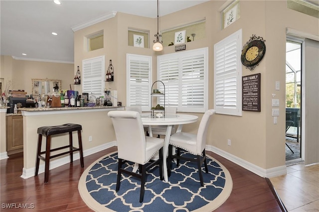 1640 Golden Gate Blvd W, Naples, FL 34117 - dining room with dark wood-style flooring, recessed lighting, and ornamental molding
