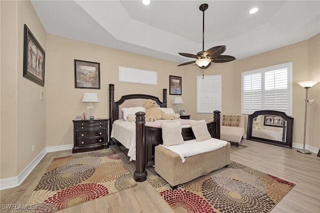 1640 Golden Gate Blvd W, Naples, FL 34117 - bedroom with wood finished floors, a tray ceiling, recessed lighting, and ceiling fan