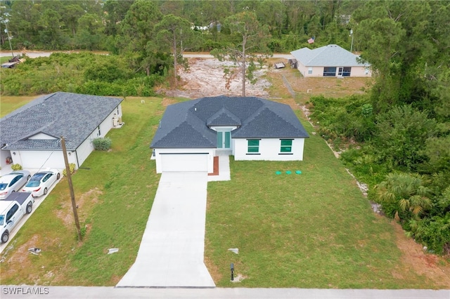 3121 71st St W, Lehigh Acres, FL 33971 - view from above of property featuring a heavily wooded area
