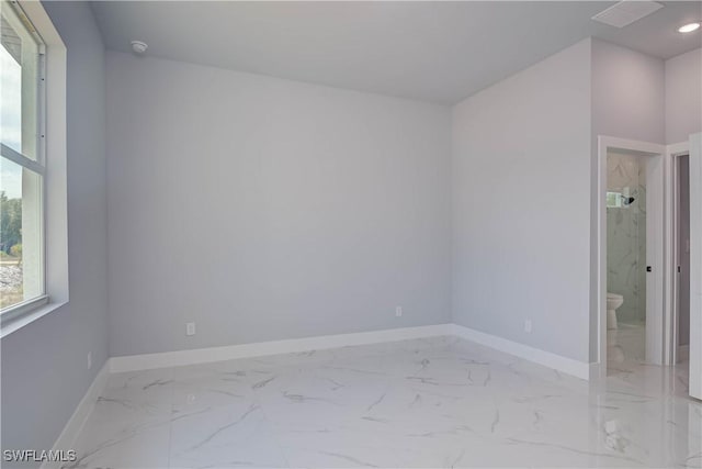 3417 71st St W, Lehigh Acres, FL 33971 - empty room with marble finish flooring, baseboards, and a smoke detector