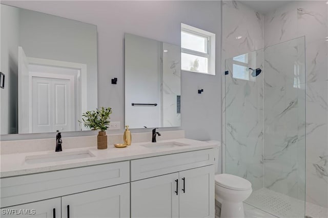 3417 71st St W, Lehigh Acres, FL 33971 - full bathroom with double vanity, a marble finish shower, and toilet