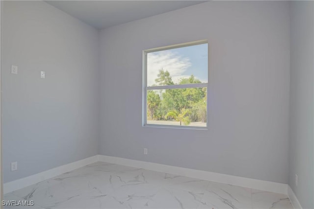 3417 71st St W, Lehigh Acres, FL 33971 - unfurnished room featuring baseboards and light marble finish flooring