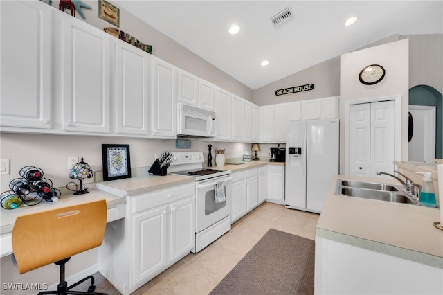 28220 Caballero Way Unit 2422, Bonita Springs, FL 34135 - kitchen featuring white appliances, a sink, light tile patterned floors, lofted ceiling, and white cabinetry