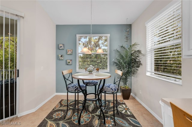 28220 Caballero Way Unit 2422, Bonita Springs, FL 34135 - dining room with light tile patterned flooring, healthy amount of natural light, and a chandelier