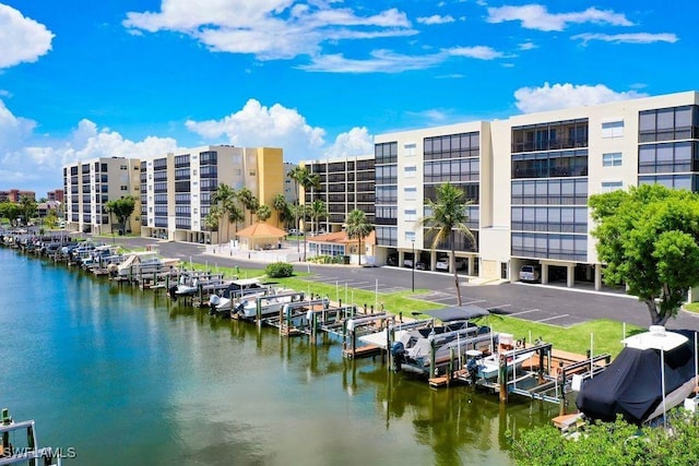 4491 Bay Beach Ln Unit 111, Fort Myers Beach, FL 33931 - water view featuring boat lift, a dock, and a marina