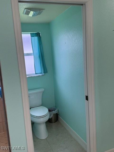 1505 NW 33rd Pl, Cape Coral, FL 33993 - bathroom featuring toilet and baseboards