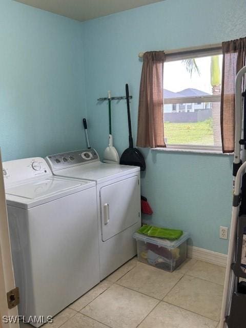 1505 NW 33rd Pl, Cape Coral, FL 33993 - washroom with washer and dryer and light tile patterned flooring