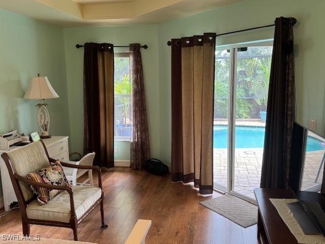 1505 NW 33rd Pl, Cape Coral, FL 33993 - sitting room with plenty of natural light and wood-type flooring