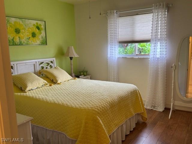 1505 NW 33rd Pl, Cape Coral, FL 33993 - bedroom with hardwood / wood-style floors and baseboards