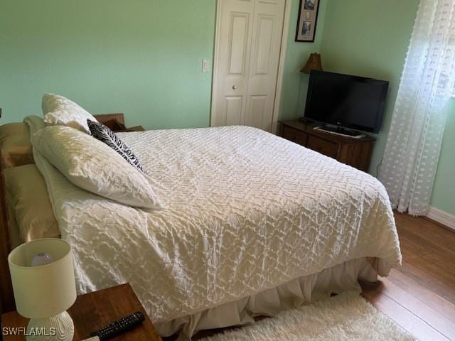 1505 NW 33rd Pl, Cape Coral, FL 33993 - bedroom with wood finished floors and a closet