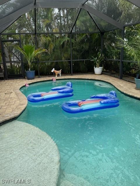 1505 NW 33rd Pl, Cape Coral, FL 33993 - swimming pool featuring a lanai