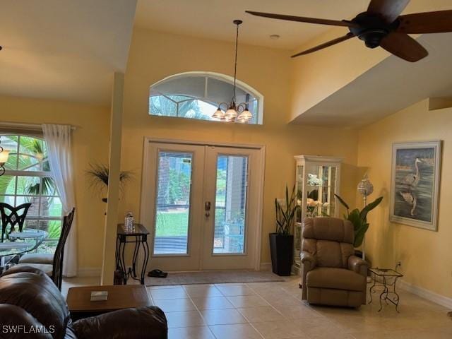 1505 NW 33rd Pl, Cape Coral, FL 33993 - entryway with french doors, tile patterned flooring, a chandelier, a ceiling fan, and lofted ceiling