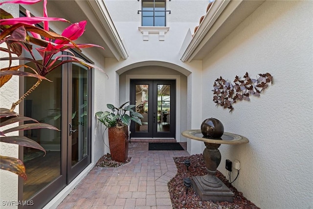 11950 Heather Woods Ct, Naples, FL 34120 - doorway to property with french doors and stucco siding