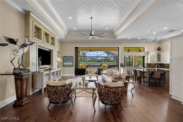 11950 Heather Woods Ct, Naples, FL 34120 - living room featuring a ceiling fan, ornamental molding, dark wood finished floors, recessed lighting, and a raised ceiling