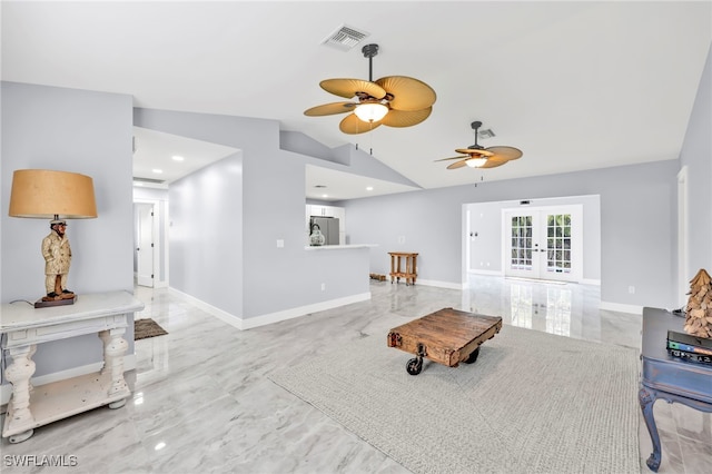 628 SW 9th Ave, Cape Coral, FL 33991 - living room featuring french doors, a ceiling fan, vaulted ceiling, baseboards, and marble finish flooring