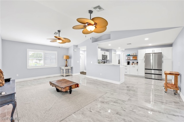628 SW 9th Ave, Cape Coral, FL 33991 - living room featuring lofted ceiling, a ceiling fan, light marble finish flooring, recessed lighting, and baseboards