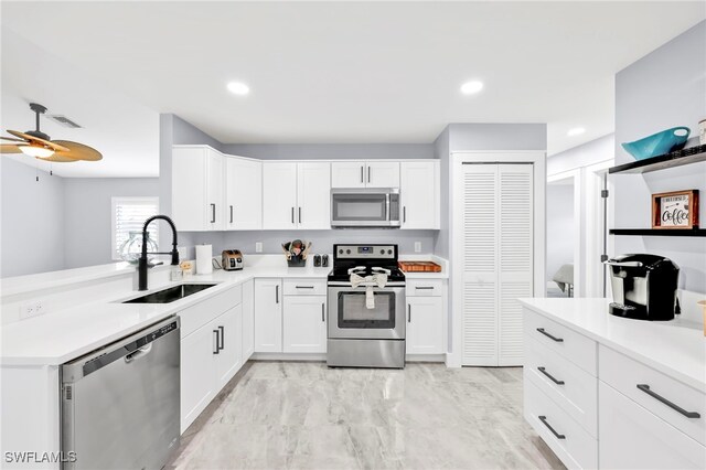 628 SW 9th Ave, Cape Coral, FL 33991 - kitchen featuring stainless steel appliances, a sink, light countertops, ceiling fan, and recessed lighting