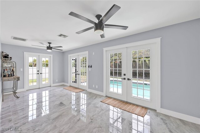 628 SW 9th Ave, Cape Coral, FL 33991 - doorway to outside featuring french doors, marble tiled floors, and ceiling fan