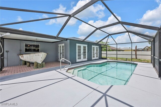 628 SW 9th Ave, Cape Coral, FL 33991 - swimming pool with french doors, a patio, and a lanai