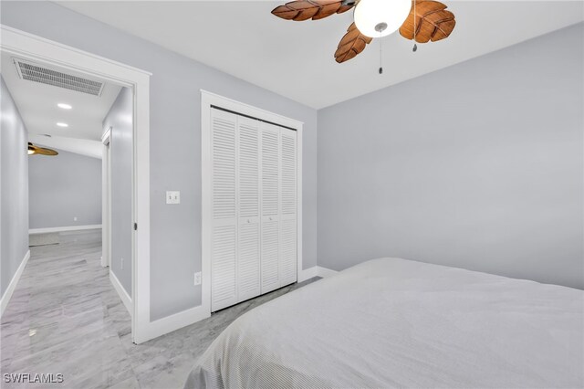 628 SW 9th Ave, Cape Coral, FL 33991 - bedroom with a closet, marble look tiles, baseboards, ceiling fan, and recessed lighting