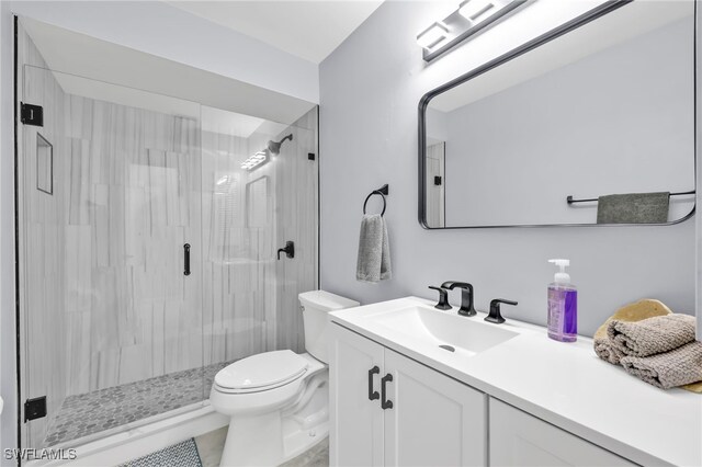 628 SW 9th Ave, Cape Coral, FL 33991 - full bathroom featuring vanity, a shower stall, and toilet
