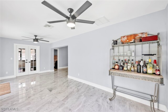628 SW 9th Ave, Cape Coral, FL 33991 - living area with ceiling fan, french doors, and baseboards