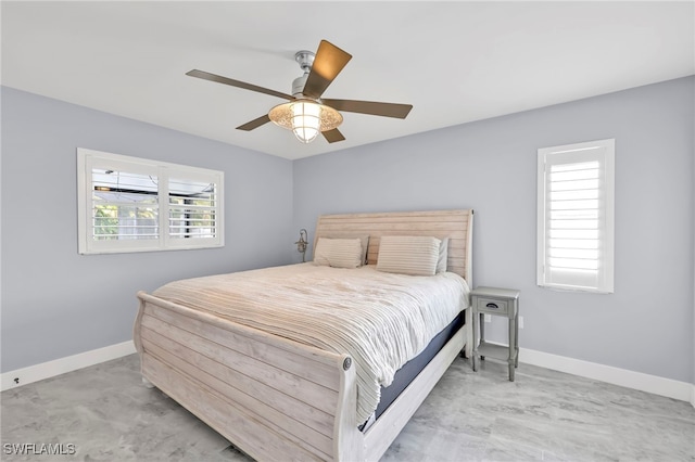 628 SW 9th Ave, Cape Coral, FL 33991 - bedroom with multiple windows, baseboards, and a ceiling fan