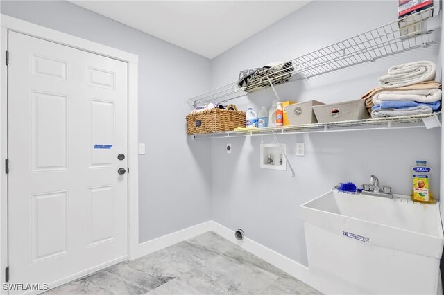 628 SW 9th Ave, Cape Coral, FL 33991 - laundry area with hookup for an electric dryer, baseboards, washer hookup, and light marble finish floors
