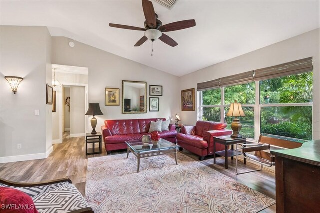 1440 14th Ave NE, Naples, FL 34120 - living room with light wood-style floors, lofted ceiling, and a ceiling fan