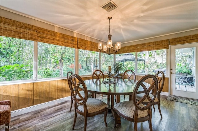 1440 14th Ave NE, Naples, FL 34120 - sunroom / solarium featuring a chandelier and wood finished floors