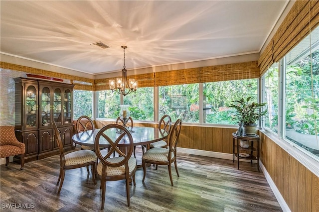 1440 14th Ave NE, Naples, FL 34120 - sunroom / solarium with a chandelier, wood finished floors, wooden walls, french doors, and a wooden deck
