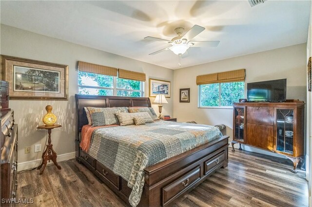 1440 14th Ave NE, Naples, FL 34120 - bedroom with dark wood-style floors and ceiling fan