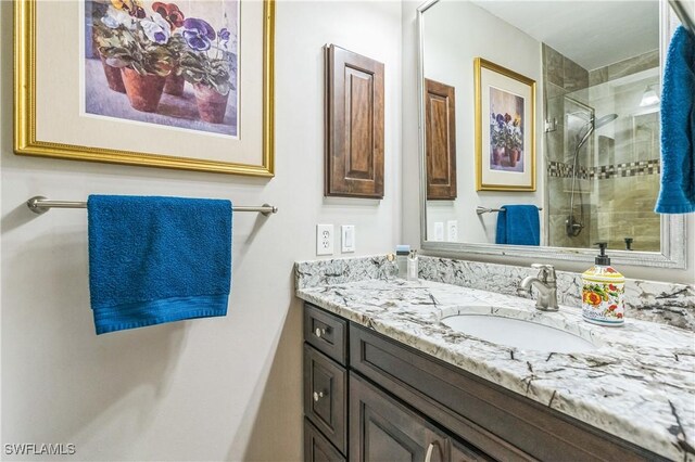 1440 14th Ave NE, Naples, FL 34120 - bathroom featuring vanity and tiled shower