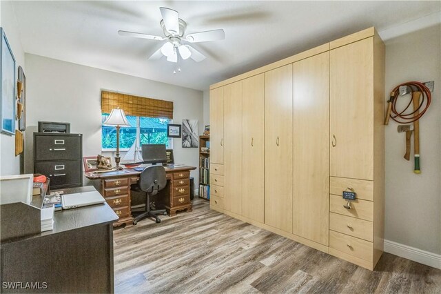 1440 14th Ave NE, Naples, FL 34120 - home office with light wood finished floors and a ceiling fan