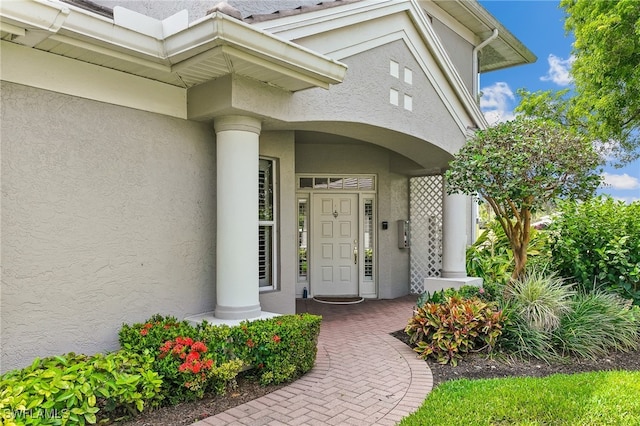 3051 Lancaster Dr Unit 4, Naples, FL 34105 - view of exterior entry featuring stucco siding