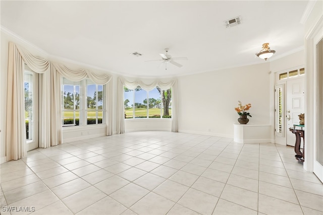 3051 Lancaster Dr Unit 4, Naples, FL 34105 - spare room with ceiling fan, crown molding, light tile patterned floors, and baseboards