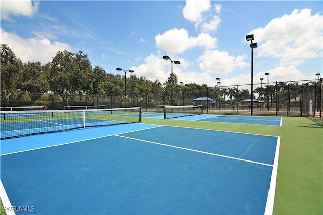 3051 Lancaster Dr Unit 4, Naples, FL 34105 - view of tennis court with community basketball court